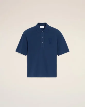 Ami de Coeur Polo en coton bleu avec écusson en tricot