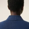 Ami de Coeur Polo en coton bleu avec écusson en tricot