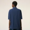 Ami de Coeur Polo en coton bleu avec écusson en tricot