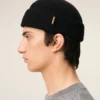 Bonnet en laine noire avec étiquette en cuir « Ami »