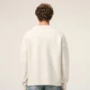 Cardigan en laine naturelle avec motif Ami de Coeur contrasté
