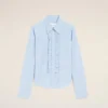 Chemise ajustée à manches longues en coton bleu à volants