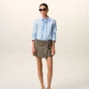 Chemise ajustée à manches longues en coton bleu à volants