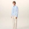 Chemise ajustée à manches longues en coton bleu à volants