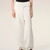 Jean blanc en coton à taille élastiquée et ceinture enveloppante, coupe ballon