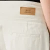 Jean blanc en coton à taille élastiquée et ceinture enveloppante, coupe ballon