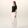 Jean blanc en coton à taille élastiquée et ceinture enveloppante, coupe ballon