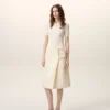 Jupe midi en laine vierge blanche avec grande boucle de ceinture