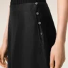 Jupe trapèze midi en soie noire transparente avec jupon