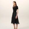 Jupe trapèze midi en soie noire transparente avec jupon