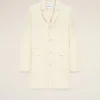 Manteau droit simple boutonnage en laine vierge blanche