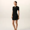 Mini-jupe en laine vierge noire avec ceinture à grande boucle
