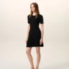 Mini-robe en maille noire à godets
