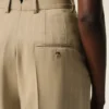 Pantalon beige en laine vierge à taille haute et jambes larges