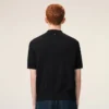 Polo noir à manches courtes en maille