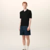Polo noir à manches courtes en maille