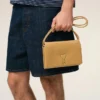 Portefeuille Voulez-Vous en cuir de vachette jaune avec lanière