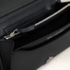 Portefeuille Voulez-Vous en cuir de vachette noir avec lanière
