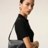 Portefeuille Voulez-Vous en cuir de vachette noir avec lanière