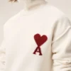 Pull à col cheminée en laine naturelle avec motif Ami de Coeur contrasté