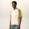 T-shirt en coton blanc et vert avec patch Ami de Coeur tricoté