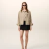 Veste Ami de Coeur en nylon beige à boutons-pression