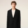 Veste droite en laine vierge noire à simple boutonnage